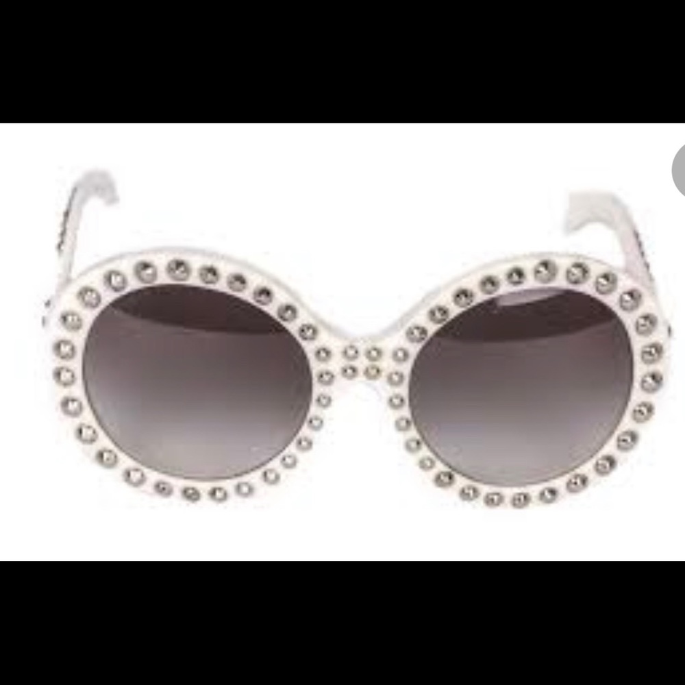 Used Prada SP29Q sunglasses with studs..please review pictures before purchase.